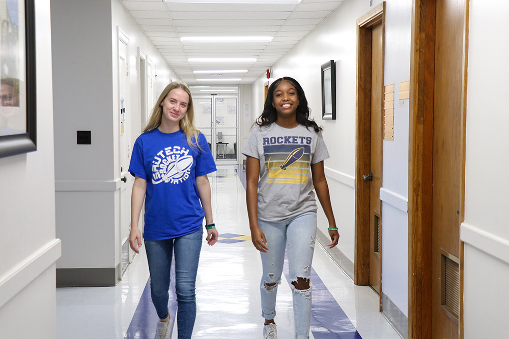 Students walking down hallway