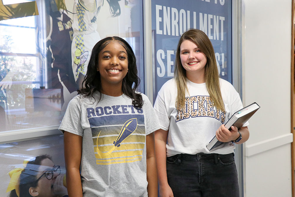 Students in front of windows